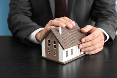 Man Holding a House - Home Loans in Alice Springs, NT